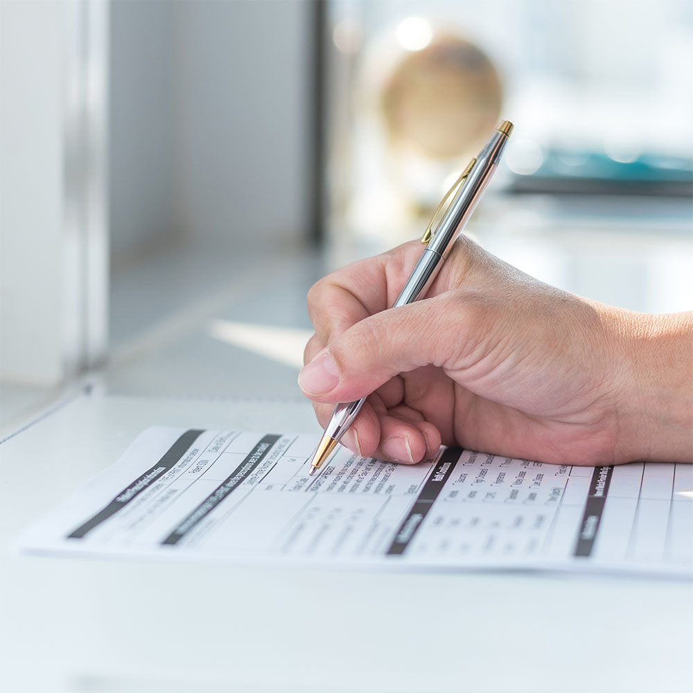 patient filling out medical forms or paperwork